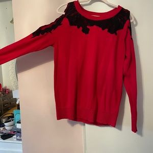 Red peekaboo shoulder knit top